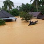 Sejumlah unit rumah warga di Kecamatan Natal, Kabupaten Mandailing Natal, Sumatra Utara, terendam banjir, Minggu (19/12/2021). /Bisnis-Nanda Fahriza Batubara
